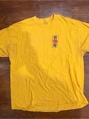 Spencer’s Men's Yellow Graphic Tee with Chest Emblem